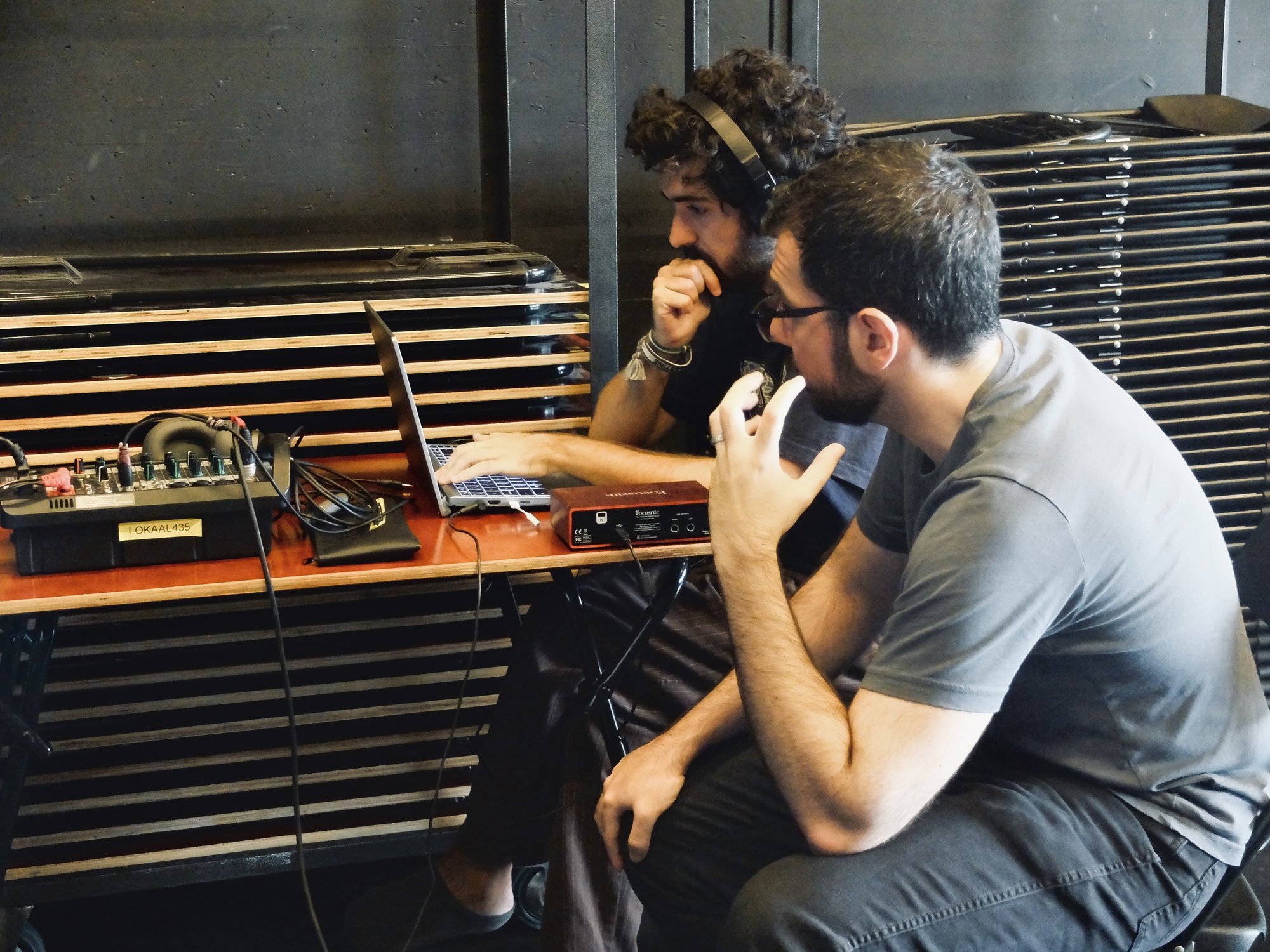 Participants working on audio setup