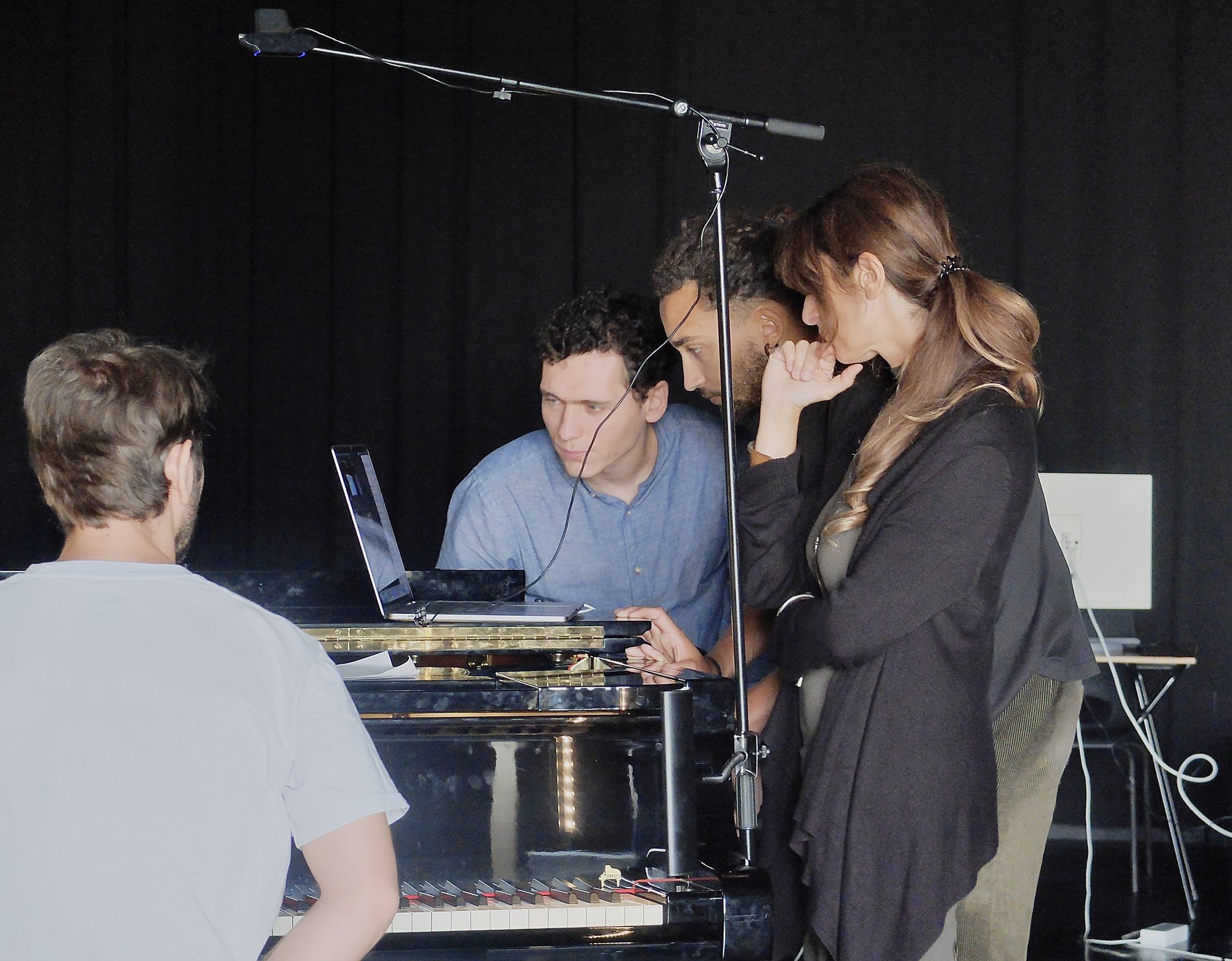 Participants working at the piano
